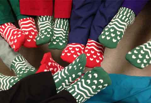 VA Boston Healthcare System staff members display green and red socks, which indicate fall potential.