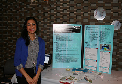 Anuja Vallabh, PGY-1 pharmacy practice resident, in front of her booth focused on “Opioid Safety.” 