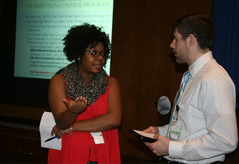 Melinda Thompson, R.N., discussing insulin safety with Justin Dedecker, administrative officer, anesthesiology department.