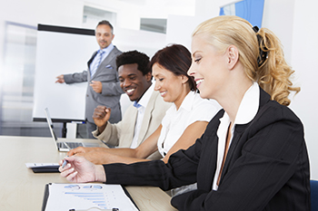 A group of professionals attend a training course.